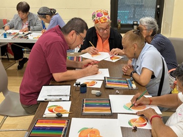 Raul Manzano and people drawing at tables
