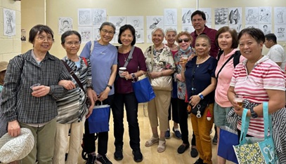 People in a gallery exhibit of student work
