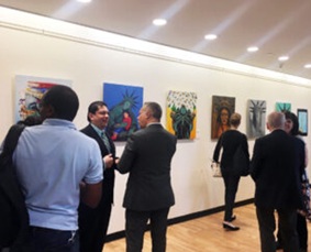 Raul Manzano and guests at art gallery. Raul Manzano and guests at art gallery.